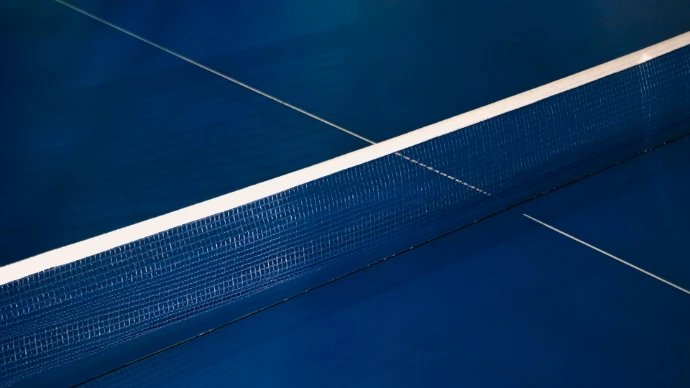 Blue ping pong table with white net